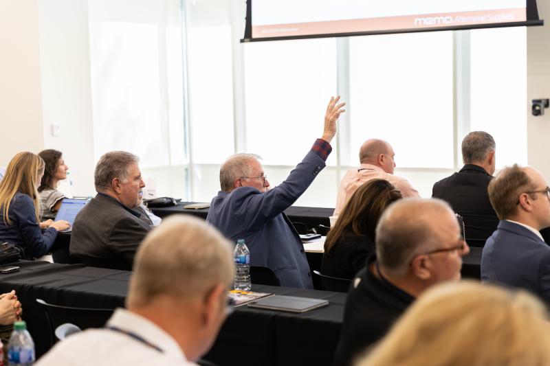 Man raising hand in meeting